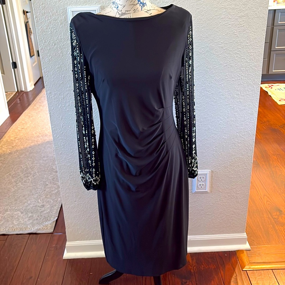 Marina black midi dress with rhinestones on sleeves .